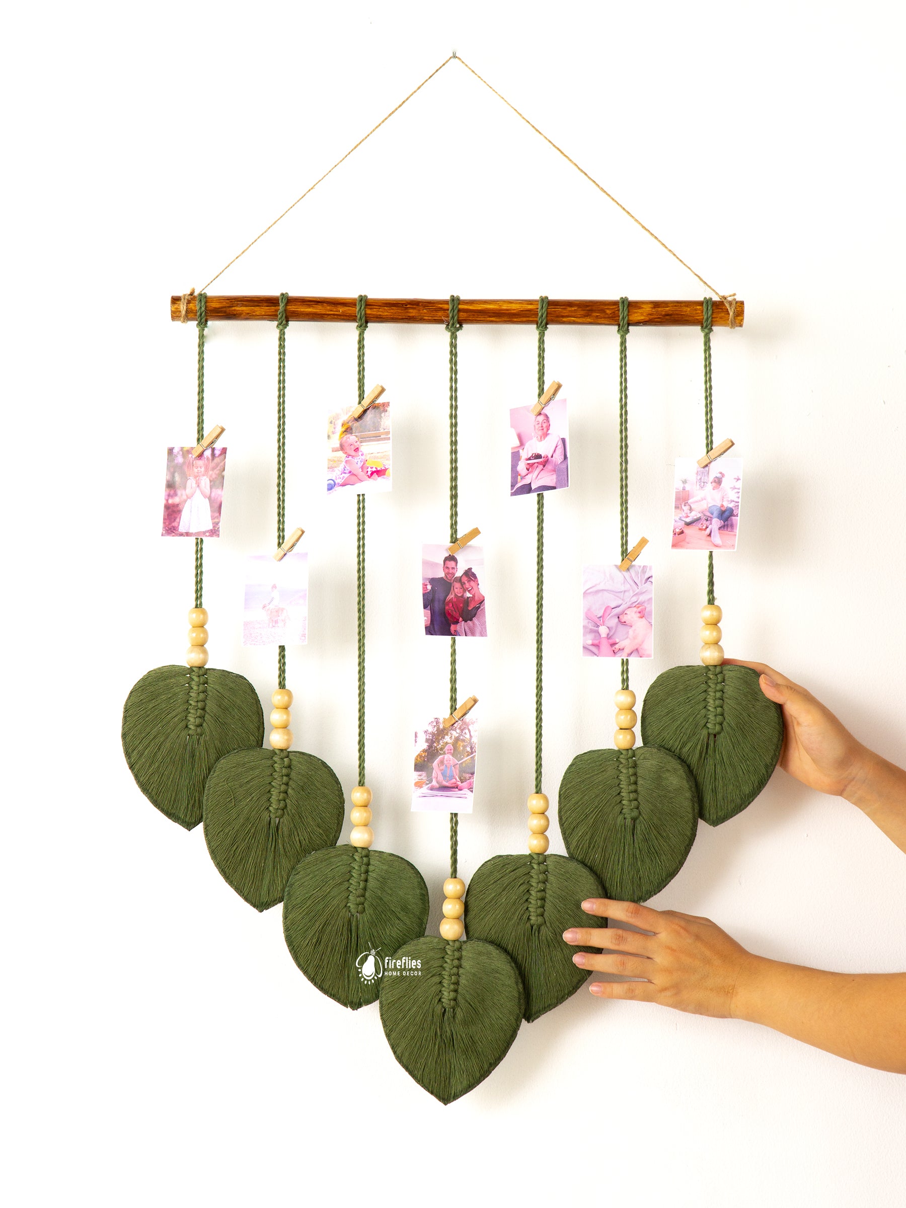 Macrame leaf photo display, great for natural or boho-inspired homes, offering a space to store special photos.
