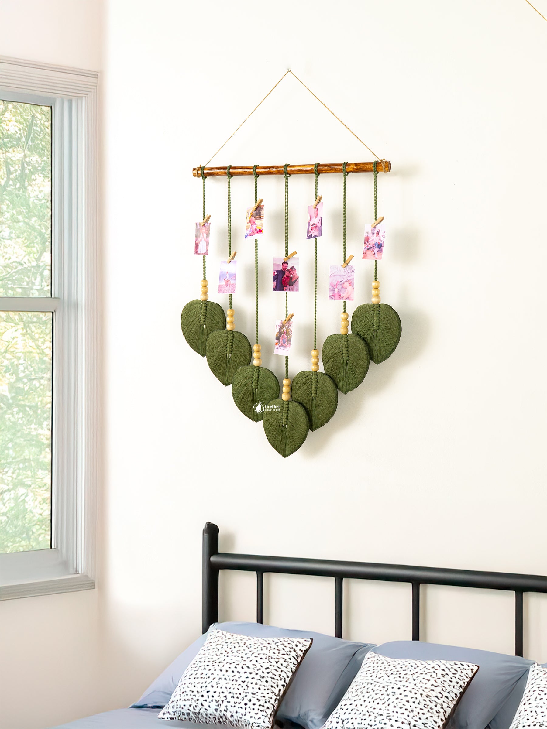 Handcrafted macrame leaf wall photo display, perfect for minimalist or natural rooms to keep cherished photos.
