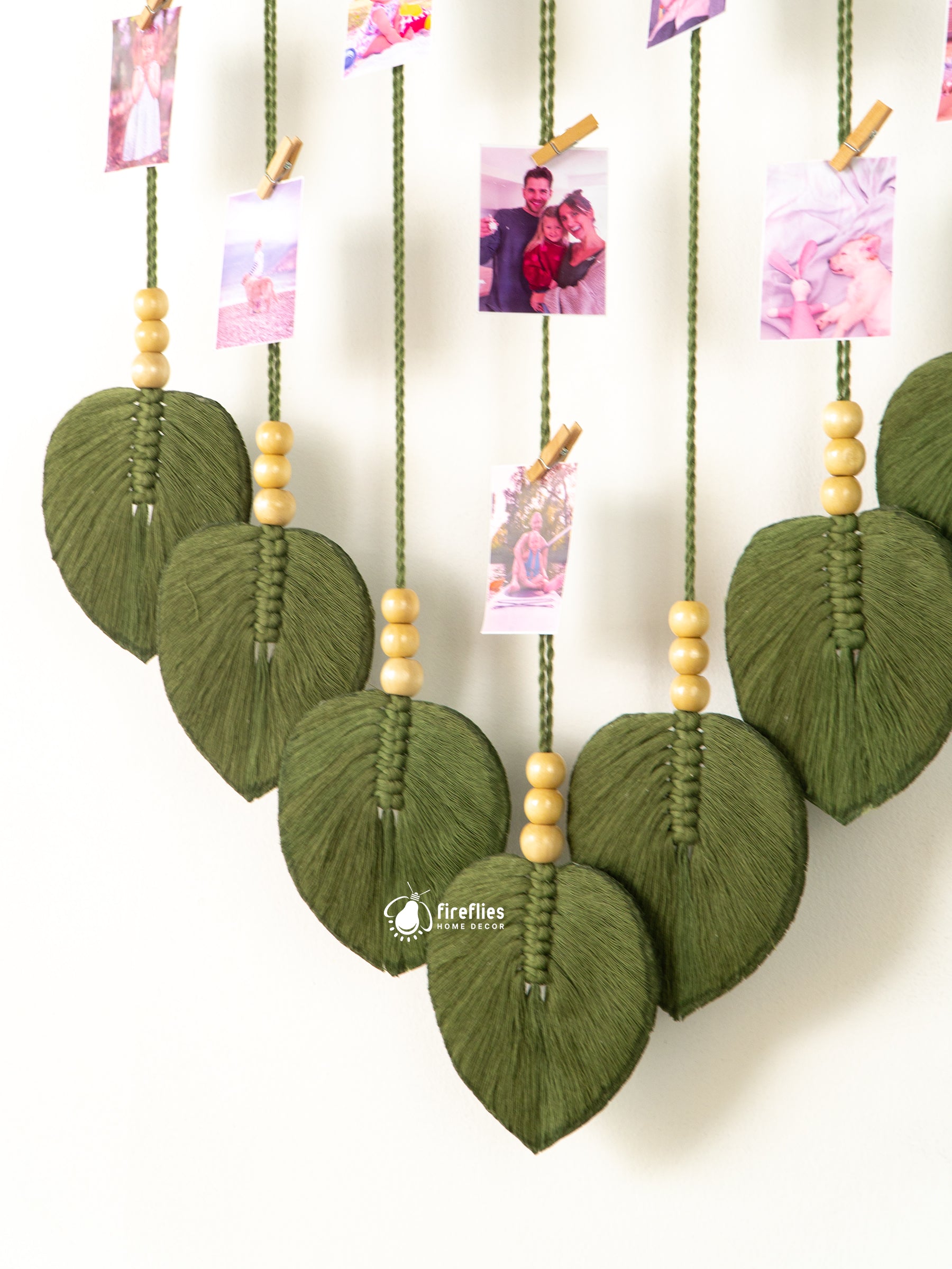 Macrame leaf photo display, great for natural or boho-inspired homes, offering a space to store special photos.
