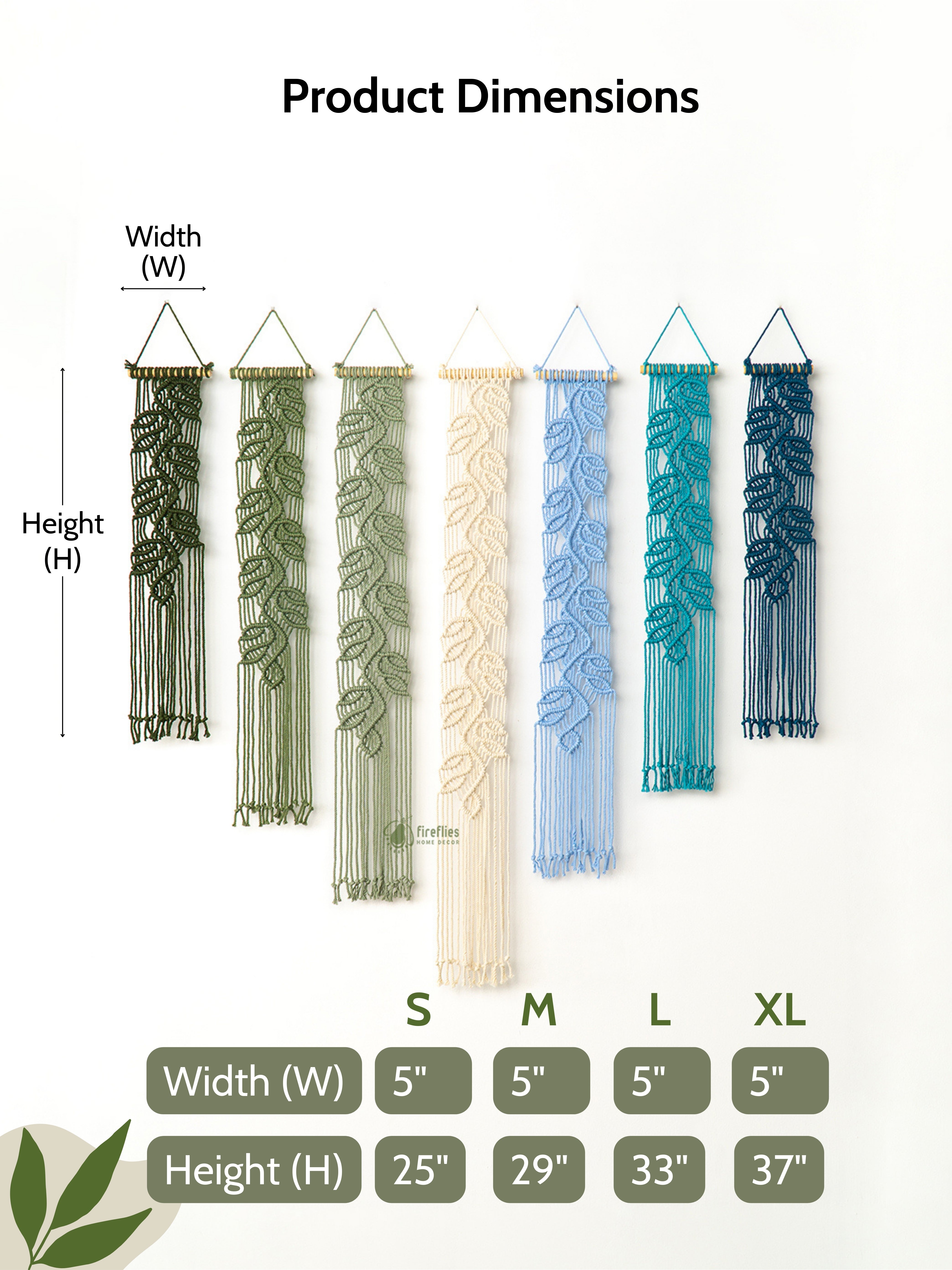 Seven macrame leaf wall hangings in a green and blue color gradient displayed above a light-colored sofa in a boho living room.