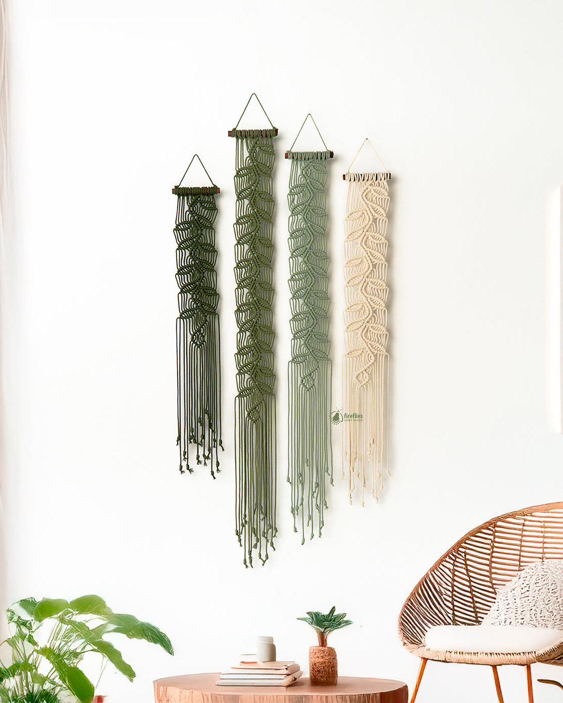 Red string art hanging above a wooden console table with decorative items.
